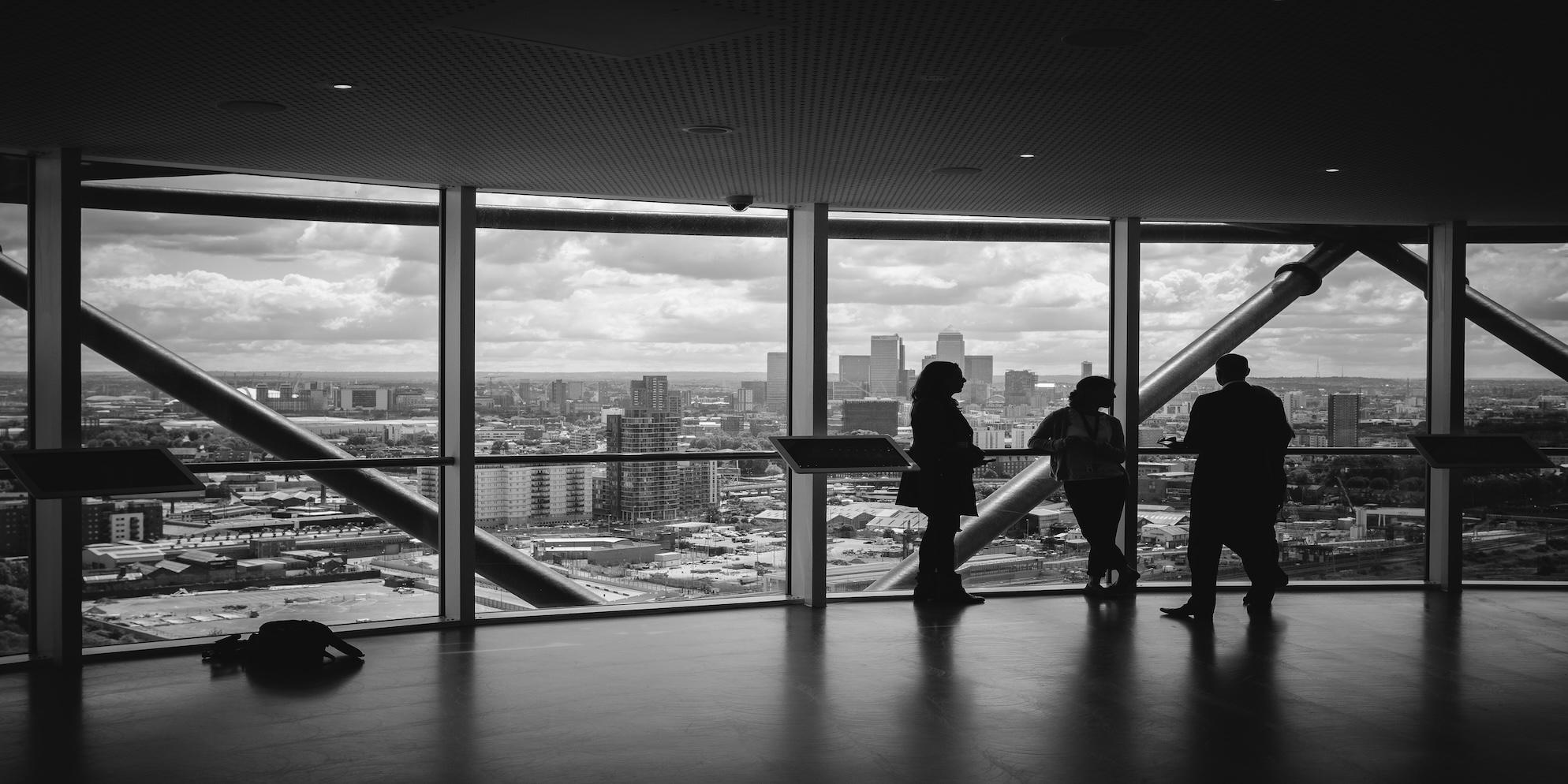 Finance professionals overlooking city skyline